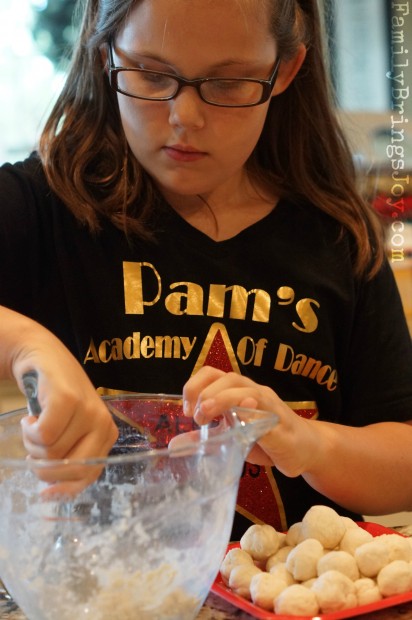 girl scooping dumpling dough familybringsjoy.com